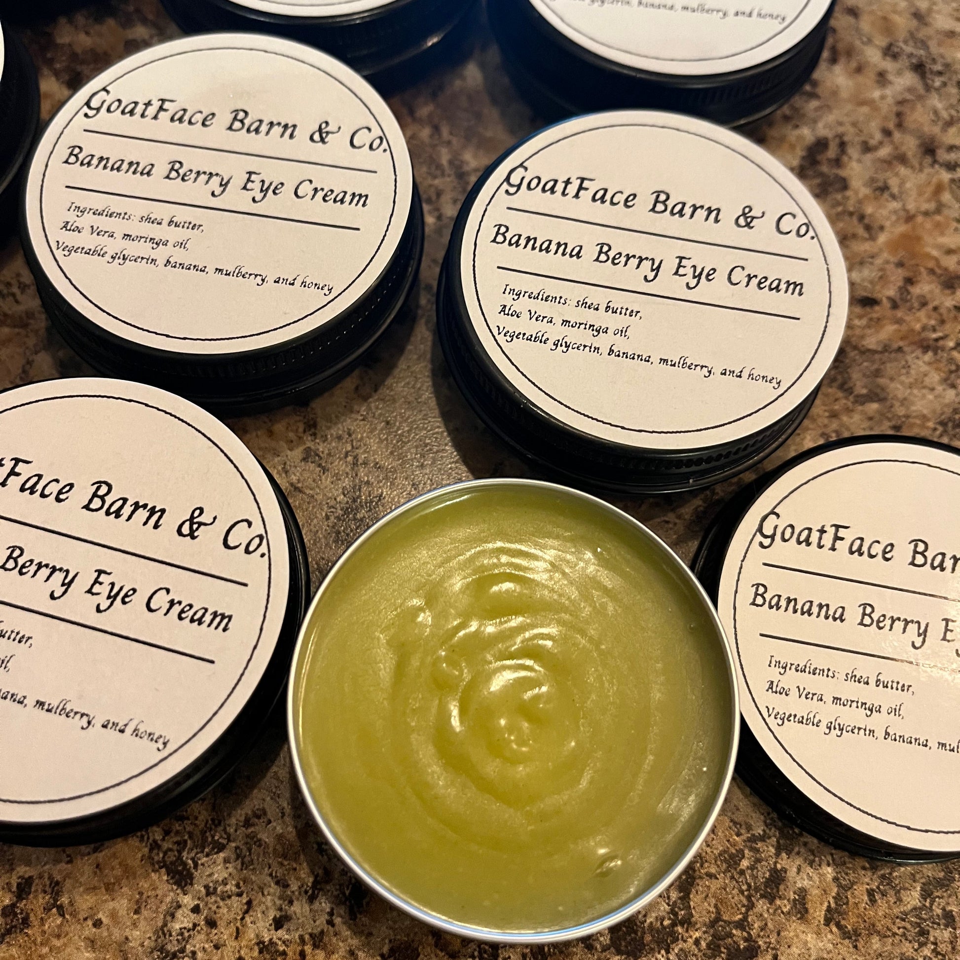 GoatFace Barn & Co. Banana Berry Eye Cream on a marble surface