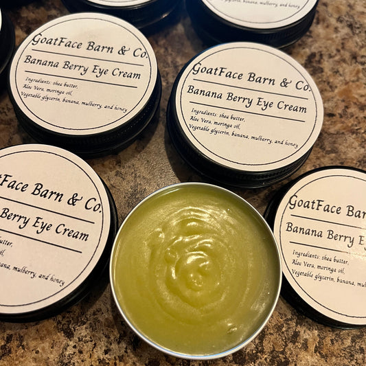 GoatFace Barn & Co. Banana Berry Eye Cream on a marble surface
